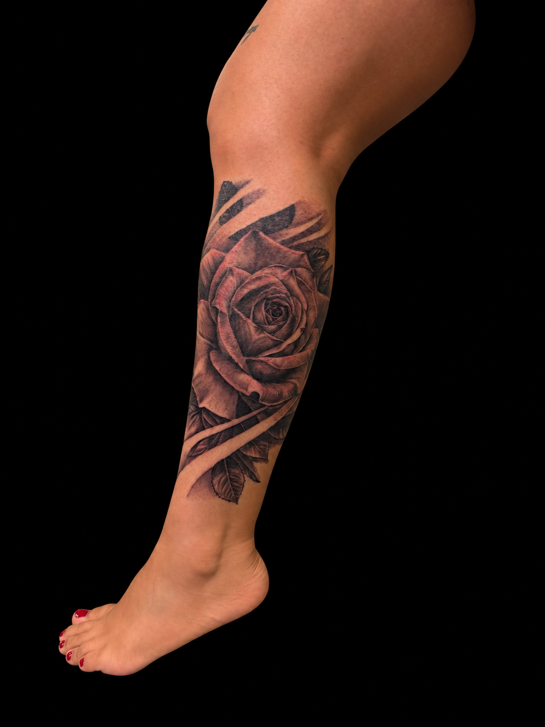Black and grey rose tattoo by Dave
