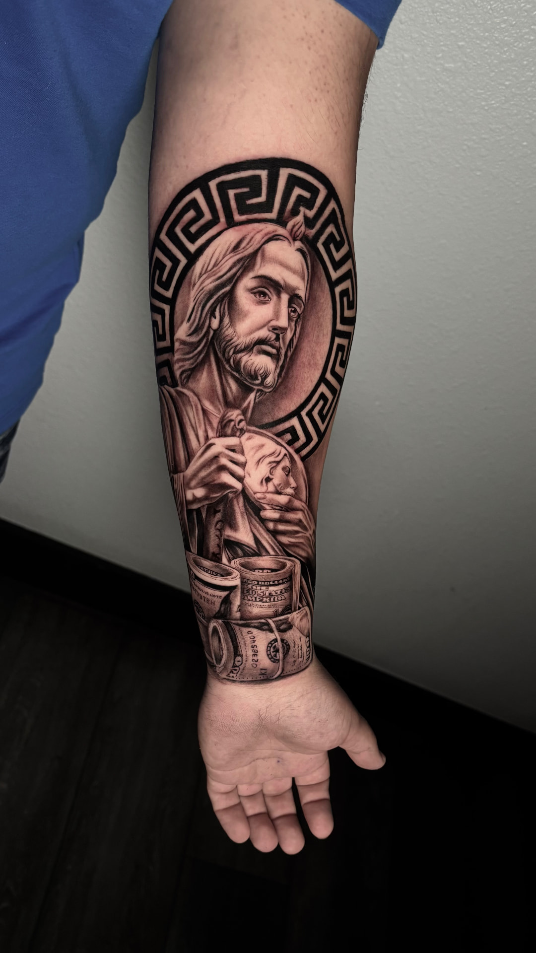 Black and grey Saint Jude and money tattoo by Joey