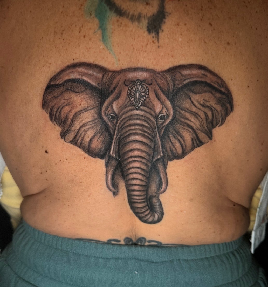 Black and grey elephant head tattoo by Quinn
