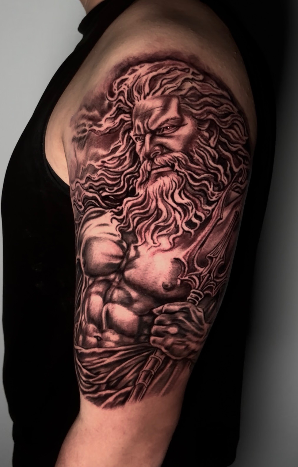 Black and grey Poseidon tattoo by Joey