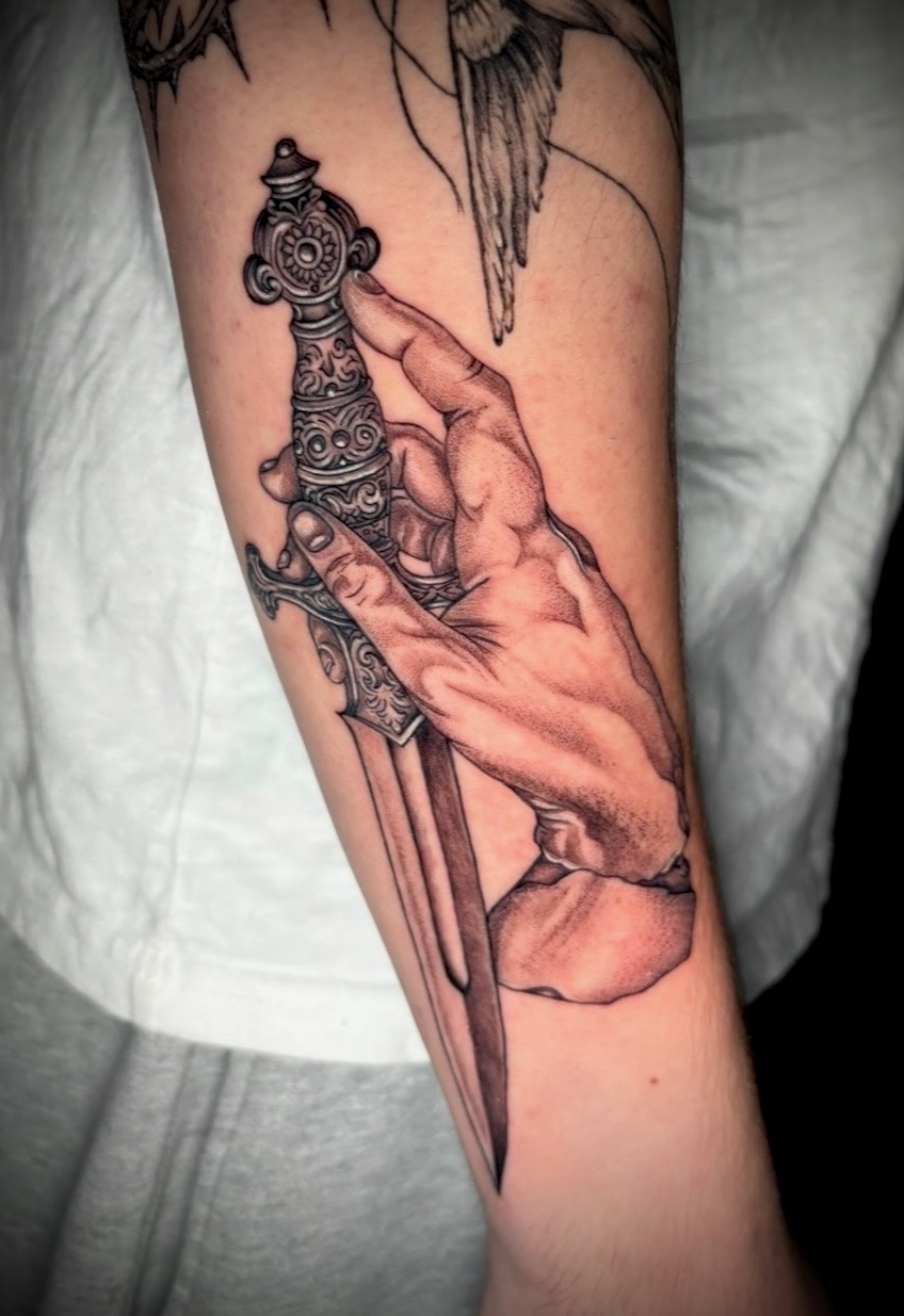 Black and grey hand and dagger tattoo by Amethyst
